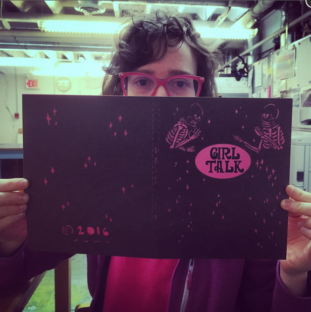 Anna Mcglynn showing off the laser cut covers of Girl Talk